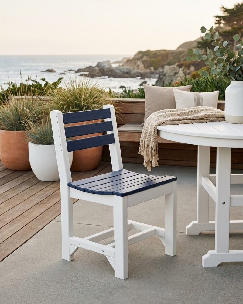Chair with blue seat and backrest on a patio with ocean view
