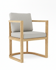 Anderson teak junus dining armchair with granite cushions on white background.  