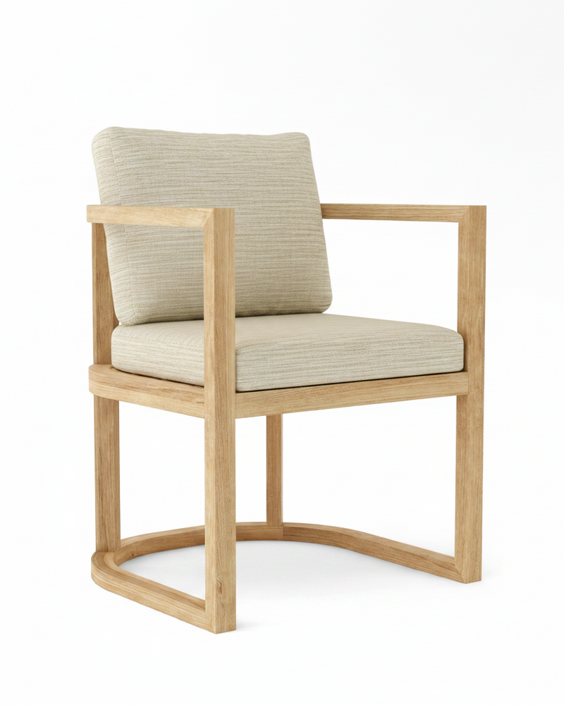 Anderson teak junus dining armchair with dupione sand cushions on white background.  