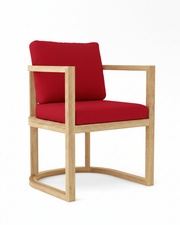 Anderson teak junus dining armchair with jockey red cushions on white background.  