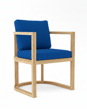 Anderson teak junus dining armchair with pacific blue cushions on white background.  