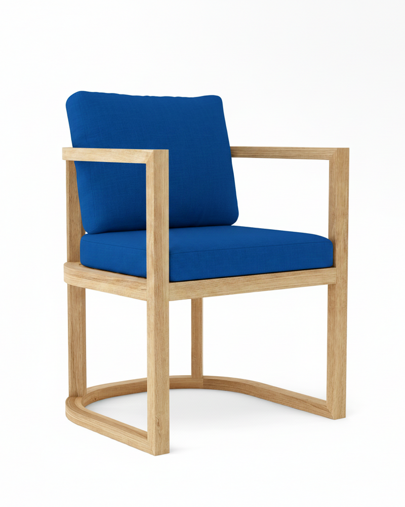 Anderson teak junus dining armchair with pacific blue cushions on white background.  