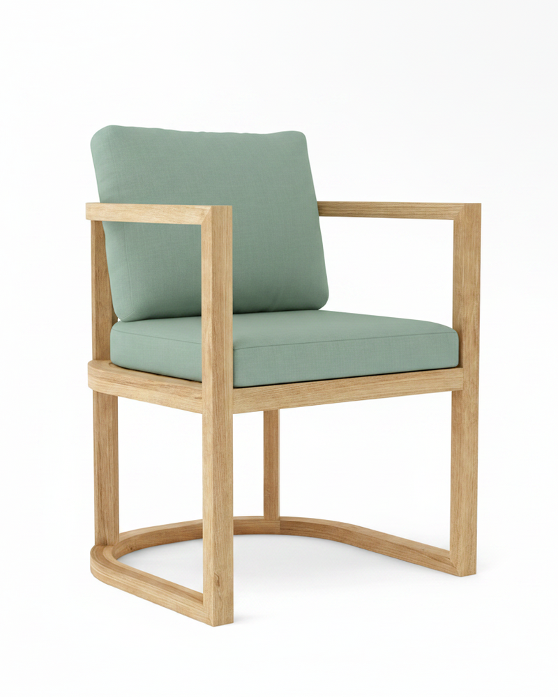 Anderson teak junus dining armchair with spa colored cushions on white background.  