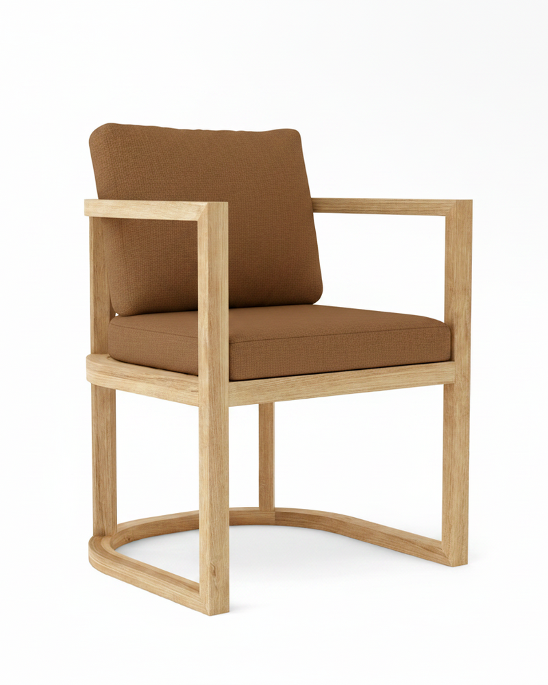 Anderson teak junus dining armchair with teak cushions on white background.  