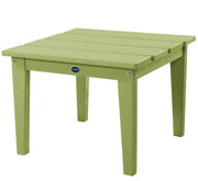 Green outdoor table with a visible brand logo on a white background