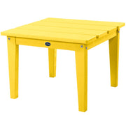 Yellow outdoor table with a visible brand logo on a white background