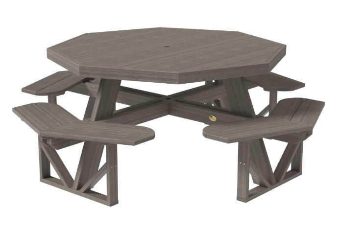 Octagonal gray picnic table with benches on a white background