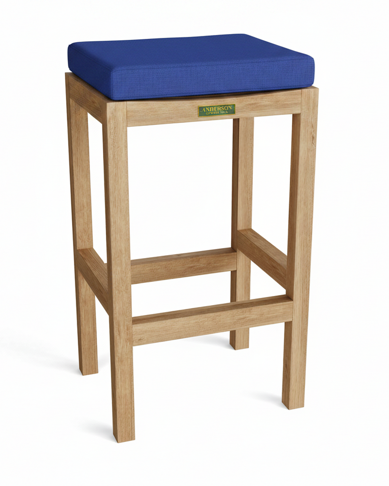 Wooden bar stool with a blue cushion on a white background