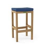 Wooden bar stool with a blue cushion on a white background