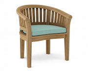 Anderson teak curved dining armchair with mineral blue cushion on white background.  