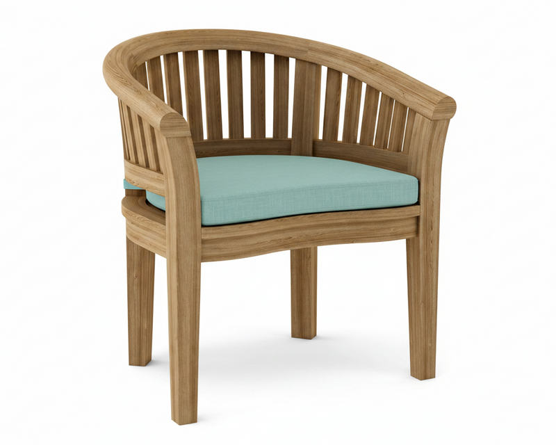 Anderson teak curved dining armchair with mineral blue cushion on white background.  