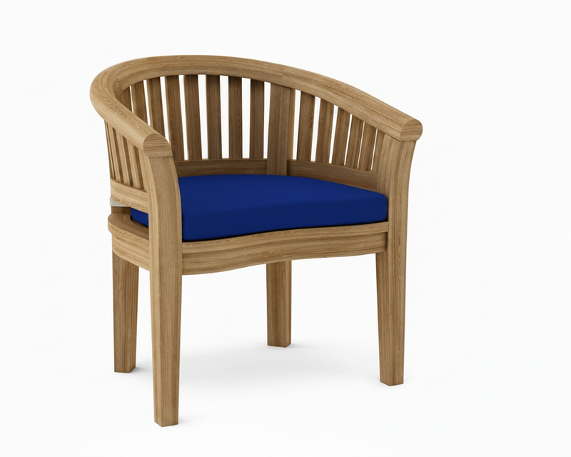 Anderson teak curved dining armchair with true blue cushions on white background.  