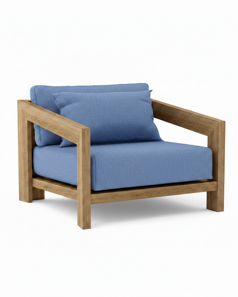 Smyrna teak lounge chair with cast ocean cushion on white background.  
