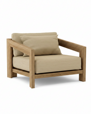 Smyrna teak lounge chair with dupione sand cushion on white background.  