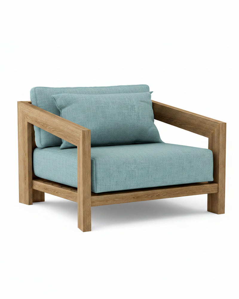 Smyrna teak lounge chair with mineral blue cushion on white background.  