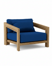 Smyrna teak lounge chair with pacific blue cushion on white background.  