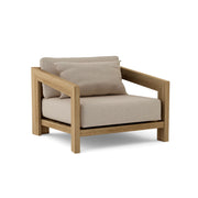 Smyrna teak lounge chair with cast ash 
cushion on white background.  
