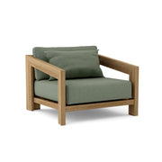 Smyrna teak lounge chair with cast sage cushion on white background.  