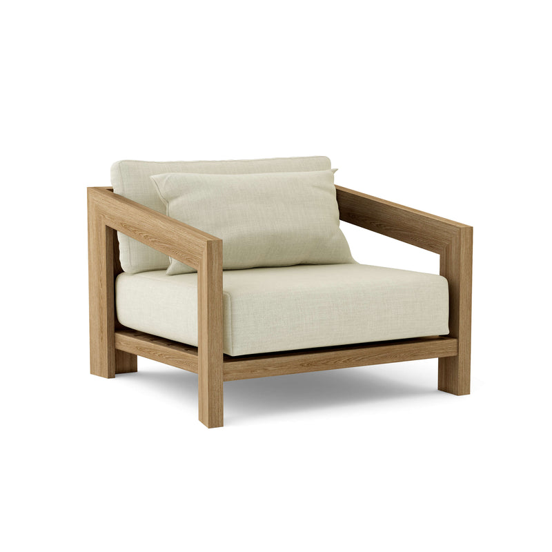 Smyrna teak lounge chair with natural cushion on white background.  