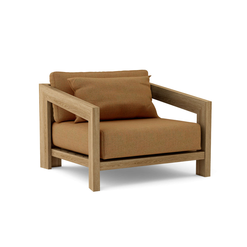 Smyrna teak lounge chair with teak cushion on white background.  