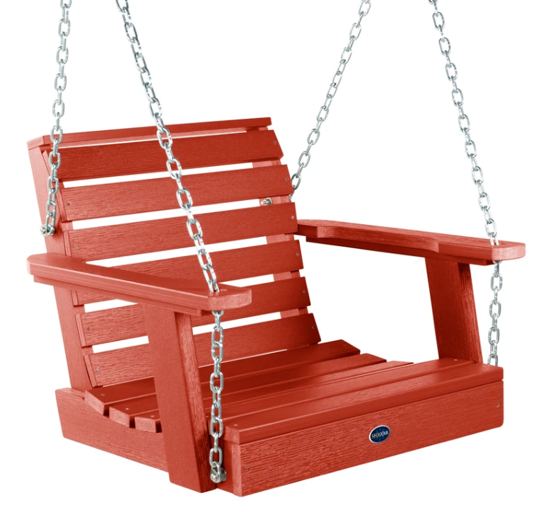 A red slatted porch swing bench with silver hanging chains, shown on a plain white background. A small oval brand badge is visible on the front right side of the seat.