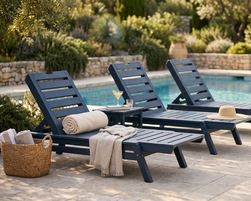 3 federal blue stackable lounge chairs by a pool 