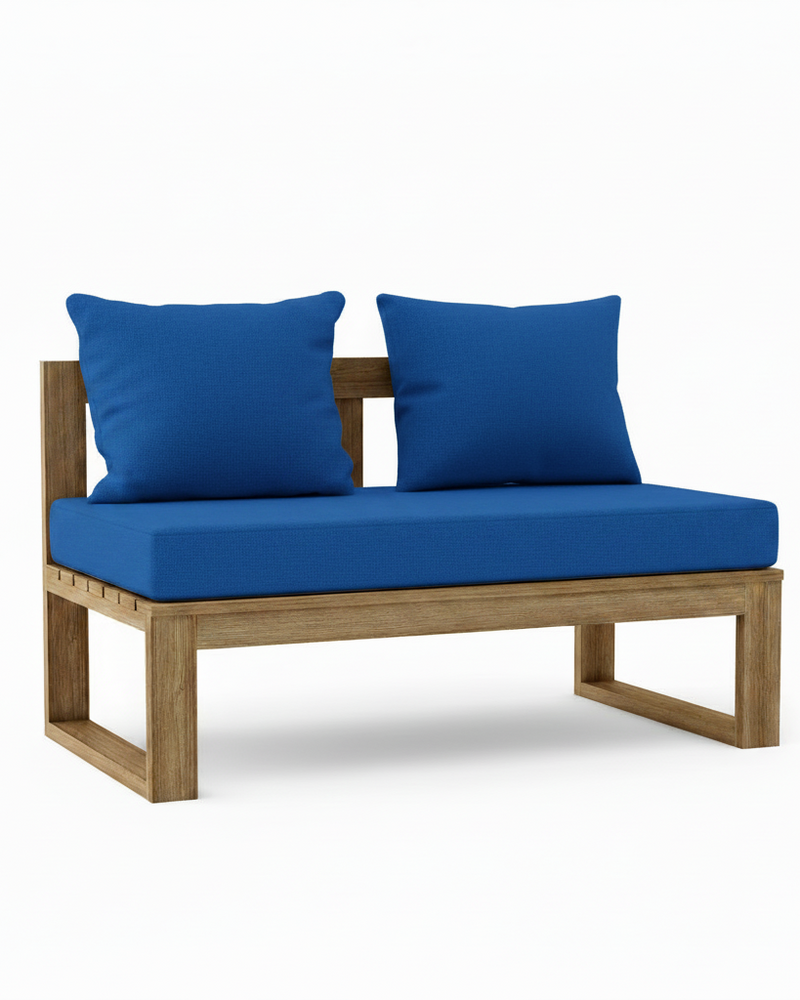 A wooden outdoor daybed with a natural teak frame, featuring a thick pacific blue seat cushion and two matching square blue back cushions, shown against a plain white background.