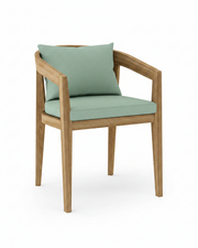 Toscana teak dining chair with spa colored cushion on white background.