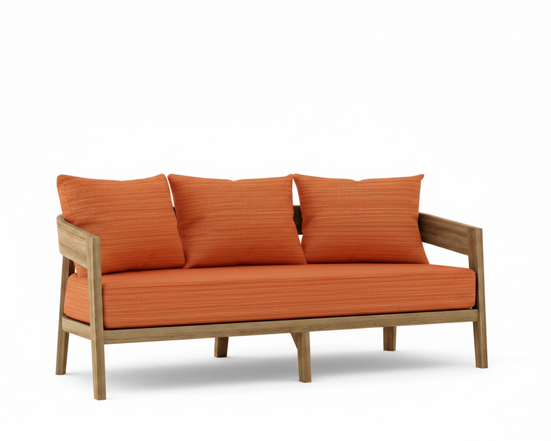 Toscana teak sofa with dupione papaya cushions on a white background.