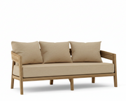 Toscana teak sofa with dupione sand cushions on a white background.