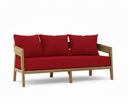 Toscana teak sofa with jockey red cushions on a white background.