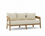 Toscana teak sofa with linen canvas cushions on a white background.