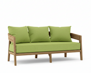 Toscana teak sofa with macaw cushions on a white background.