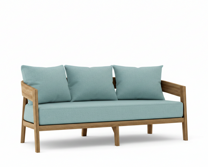 Toscana teak sofa with mineral blue cushions on a white background.