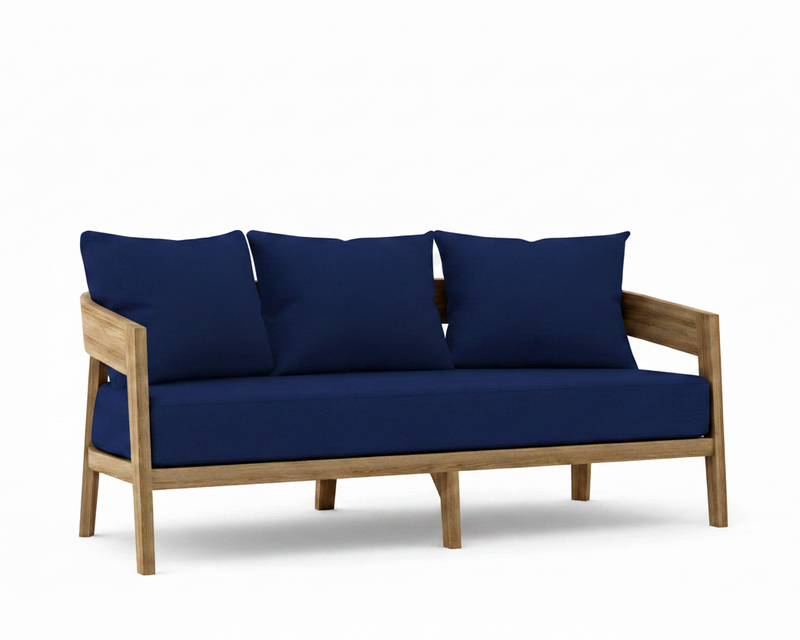 Toscana teak sofa with true blue cushions on a white background.