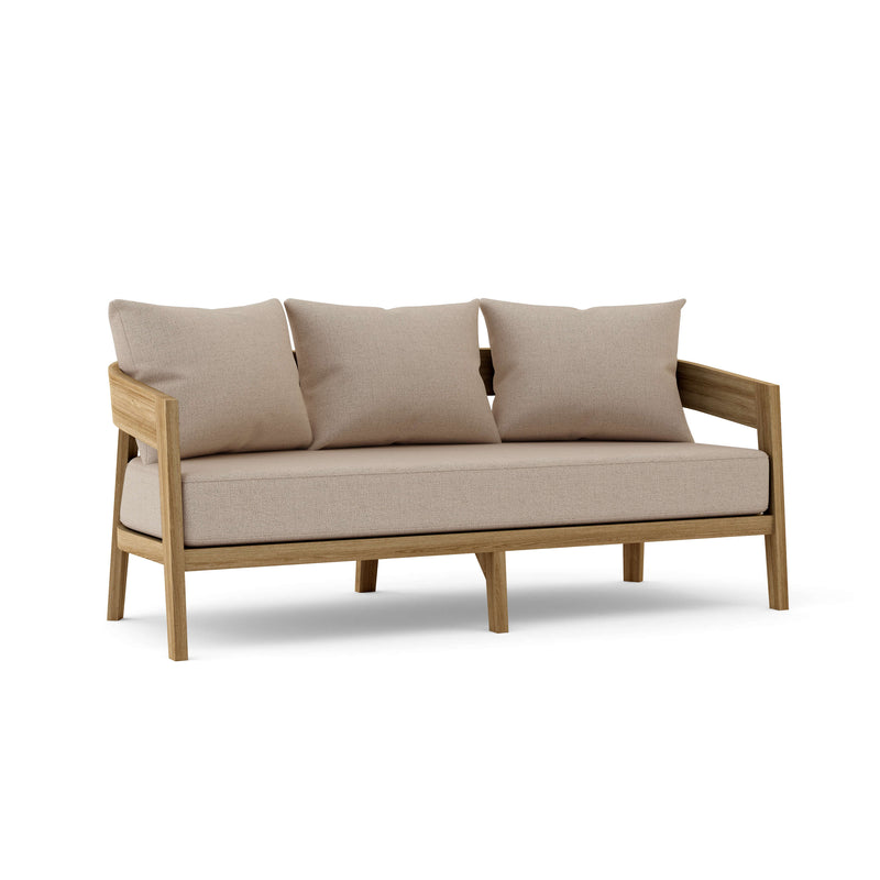 Toscana teak sofa with cast ash cushions on a white background.