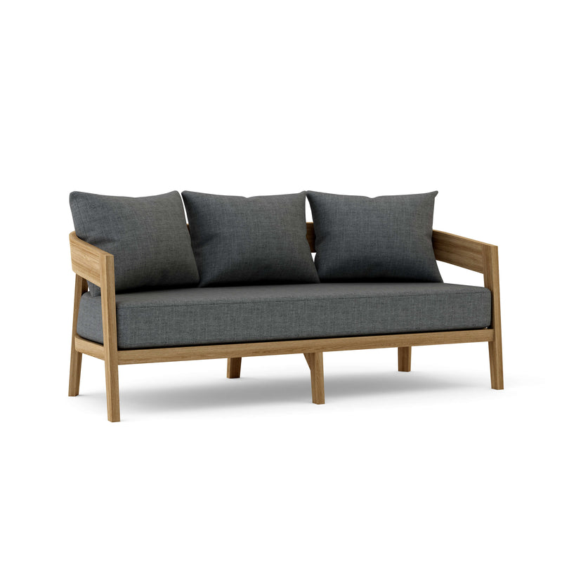 Toscana teak sofa with cast charcoal cushions on a white background.