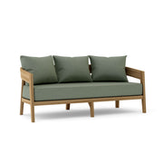 Toscana teak sofa with cast sage cushions on a white background.