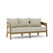 Toscana teak sofa with natural cushions on a white background.