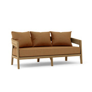 Toscana teak sofa with teak cushions on a white background.