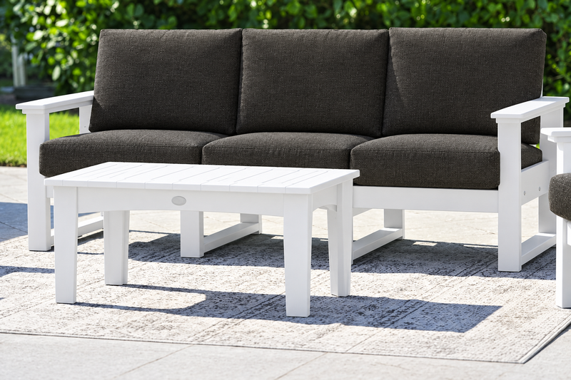 White-frame sofa with Spectrum Carbon cushions