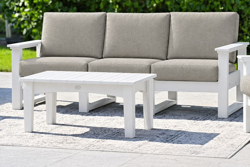 White-frame sofa with Spectrum Dove cushions