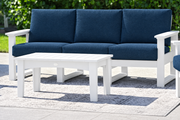 White-frame sofa with Spectrum Indigo cushions