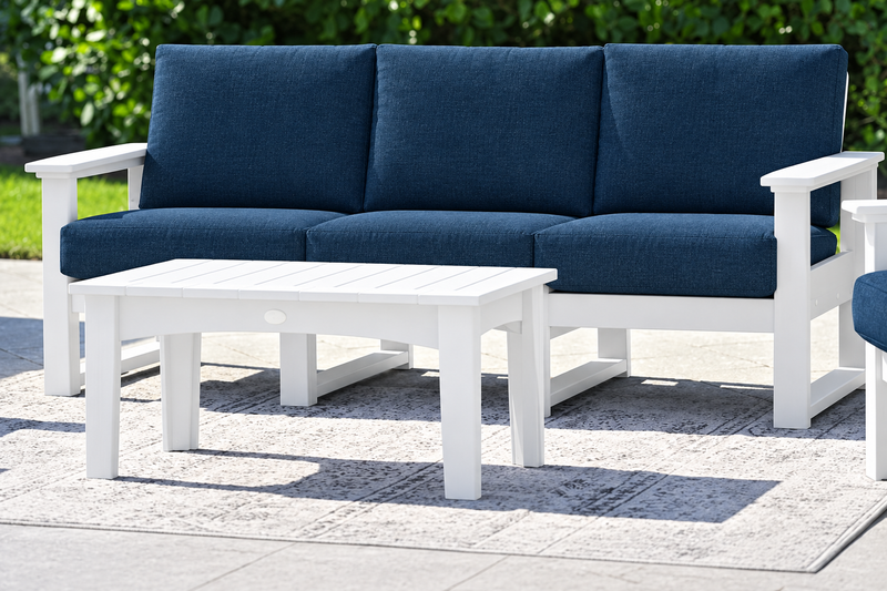 White-frame sofa with Spectrum Indigo cushions