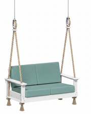 White swing with teal cushions on a white background