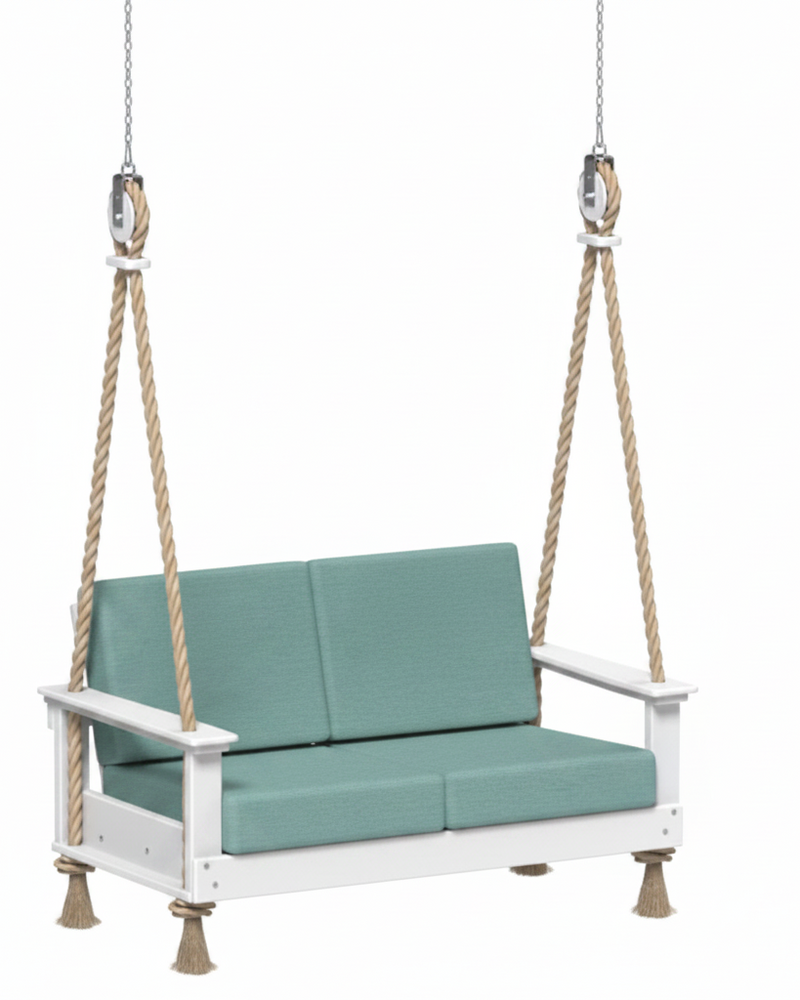 White swing with teal cushions on a white background