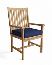 Wooden chair with a blue cushion on a white background